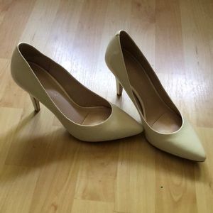 White patent leather pumps
